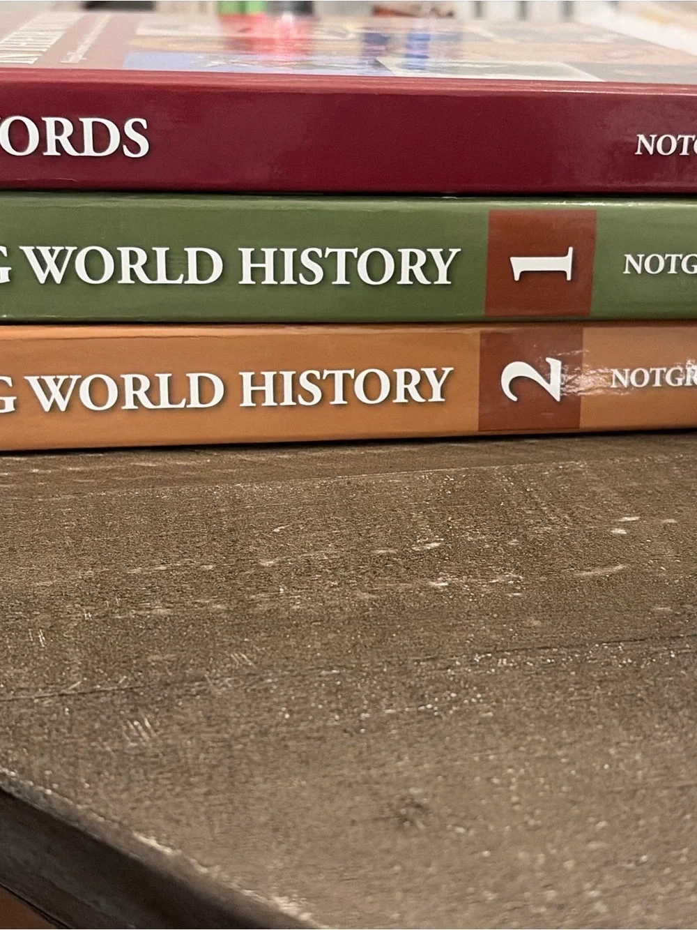Stack of Colorful World History Hardcover Books - Green, Rust, Red
